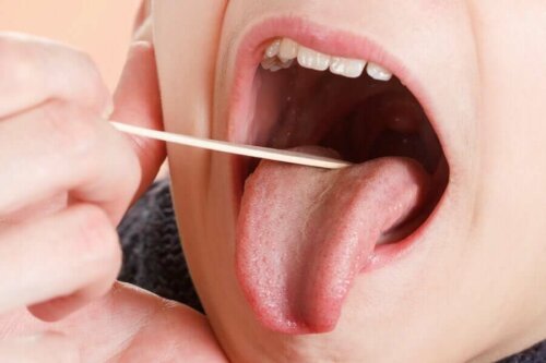 A physician looking inside a mouth.