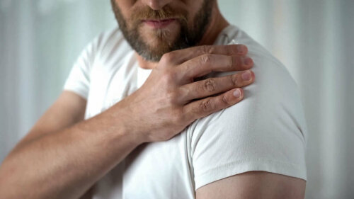 A man looking at his shoulder.