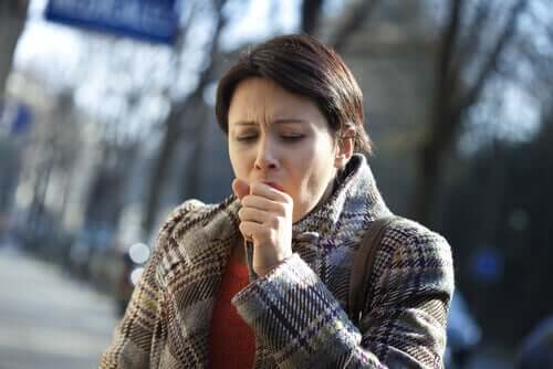 A woman coughing.