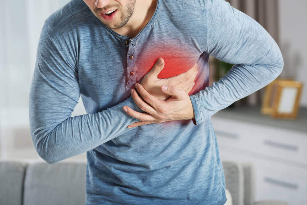 A man clutching his chest.