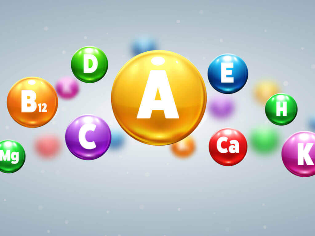 A digital image of several differently colored spheres, each representing a vitamin: A, D, B12, etc.