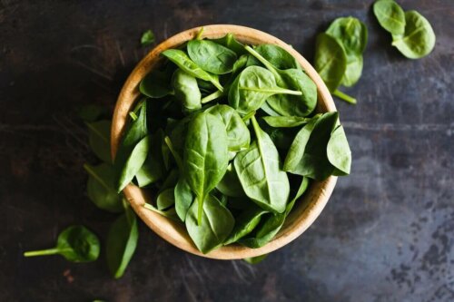A bowl of spinach.