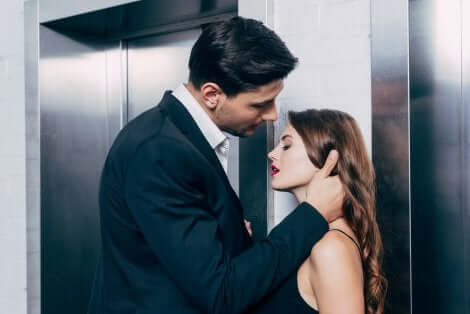 A seductive couple near an elevator.