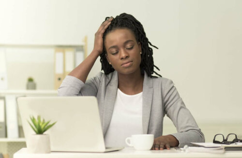 A woman with a headache.