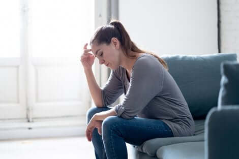 A woman worrying on her couch.