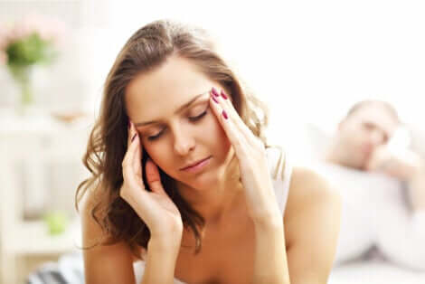 A woman suffering from a headache.