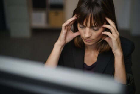 A woman with a headache.