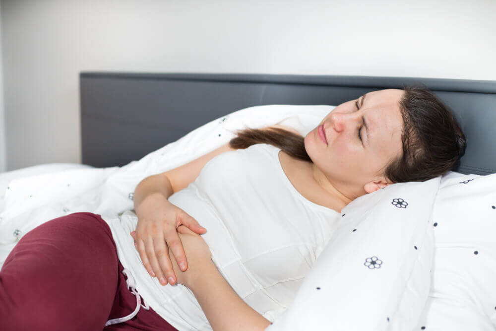 Abdominal swelling can be caused by eating too fast, food intolerances, underlying health problems, or simply eating too much.