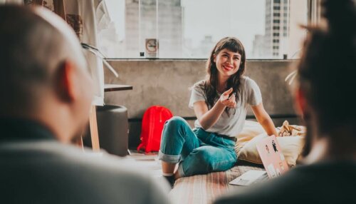 Emotional Communication; woman chatting to others, smiling