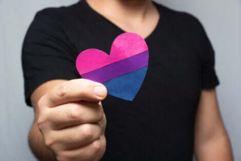 A man is holding a heart.