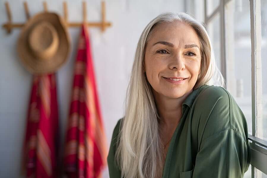 A middle-aged woman smiling.