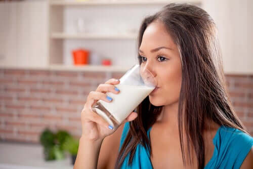 A woman drinking milk.
