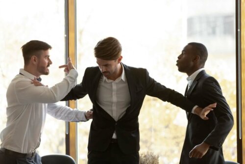 A man keeping two angry ones apart.