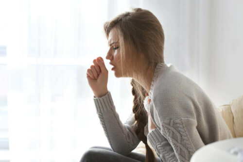 A woman coughing.