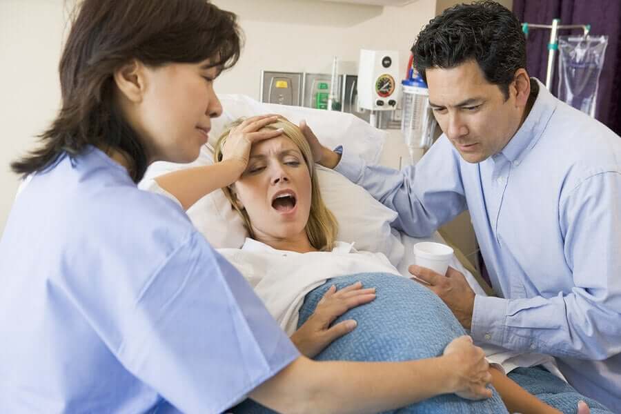 A woman giving birth.