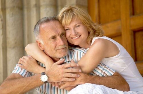 A woman hugging a man.