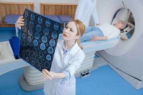 A woman reviewing a CT scan.