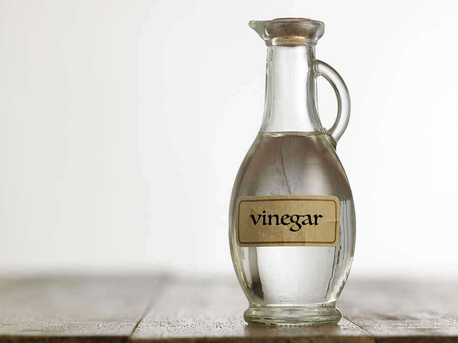 A glass container of vinegar.