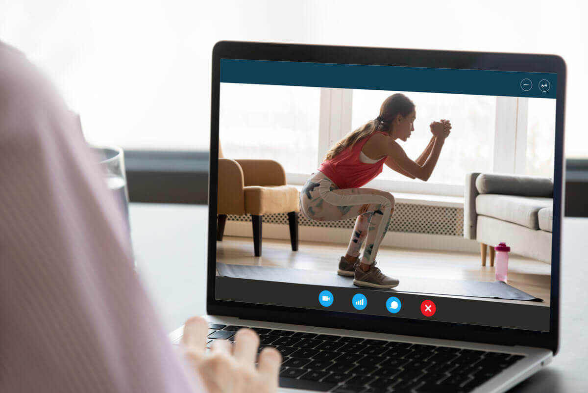 A woman exercising online.