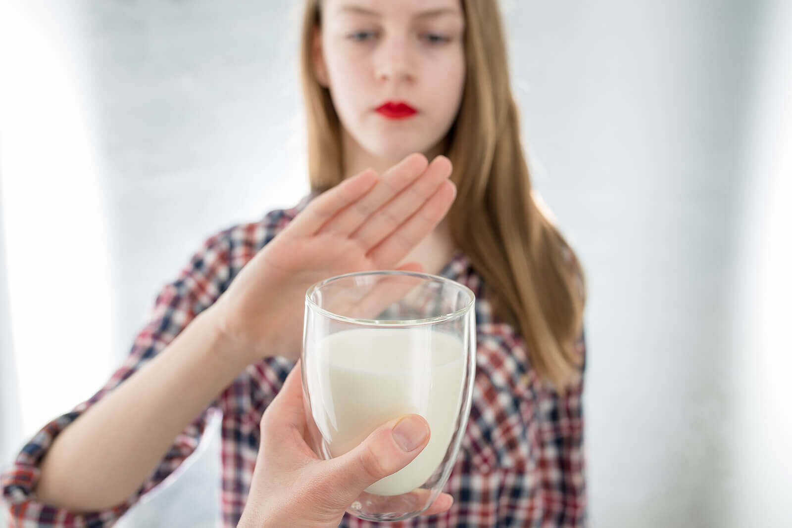 A woman who suffers from lactose intolerance.