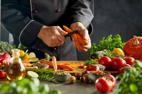 A person peeling carrots.