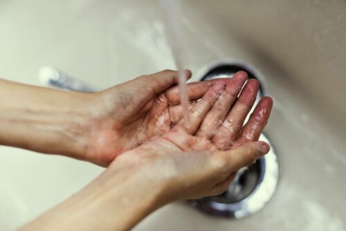 A person washing their hands.