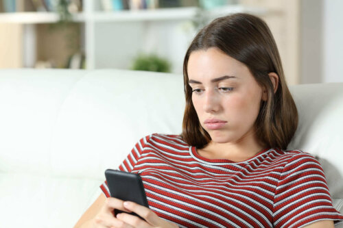 A woman looking at her phone.