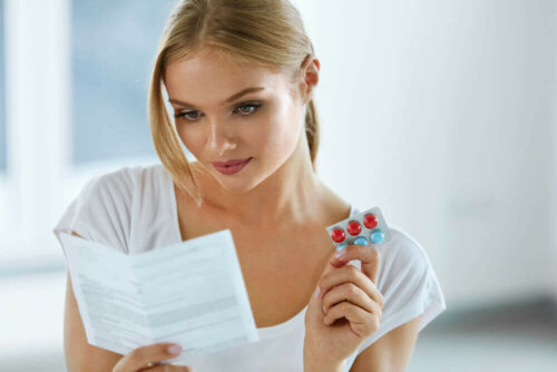 A woman reading a package insert.