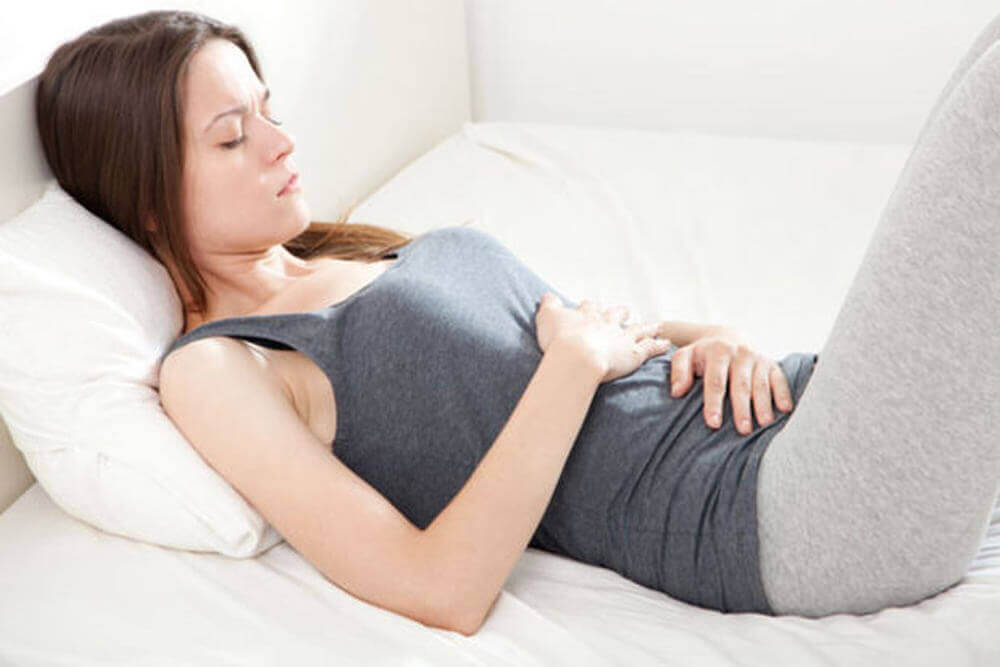 A woman with a stomach ache