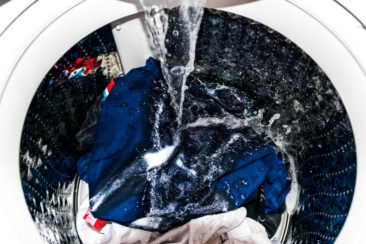 Washing machine with clothes.