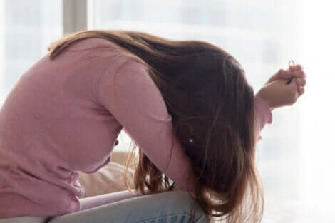 A woman feeling stressed and frustrated.