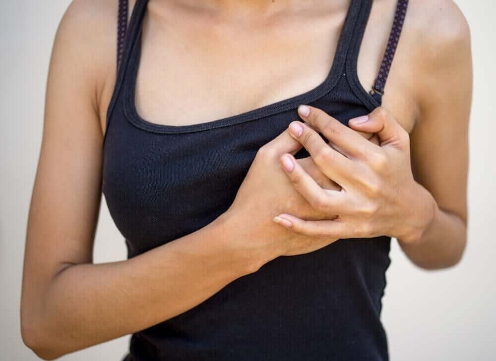 A woman grabbing her chest