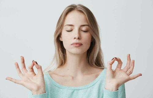 A woman meditating.