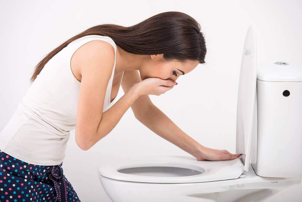 A woman vomiting.