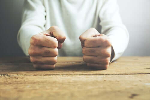 A person with clenched fists.