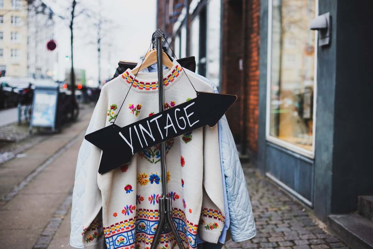 A sign outside a vintage clothes store.