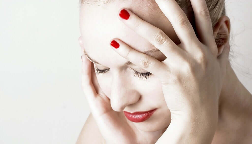 A woman with a headache.