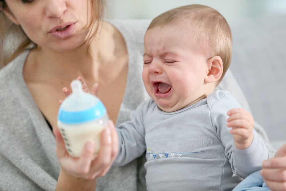 A baby crying because of itchy gums