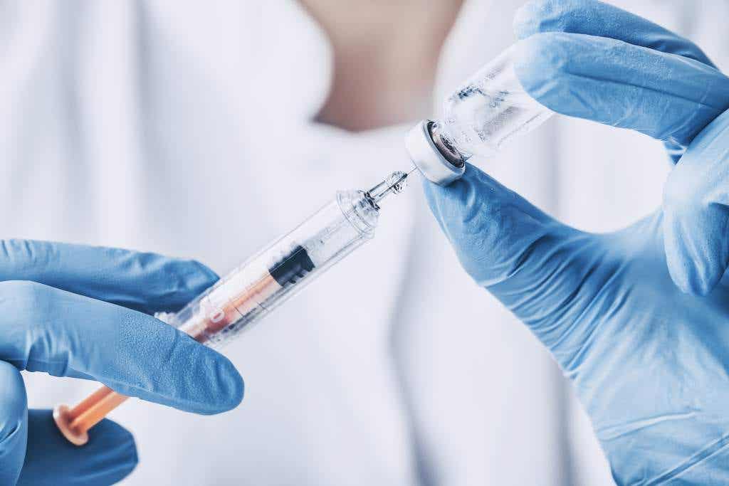 A doctor with a vaccine.