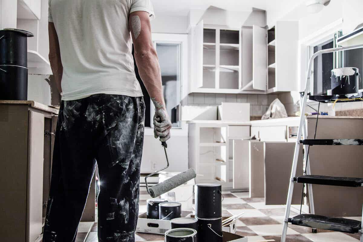 A man painting a house
