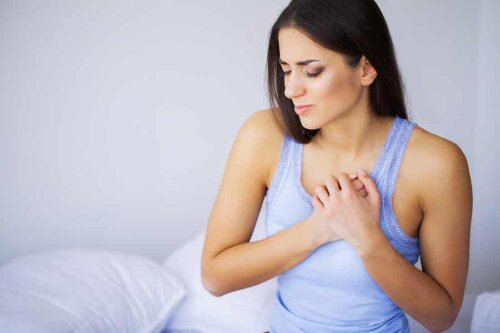 A woman with a pain on her chest.