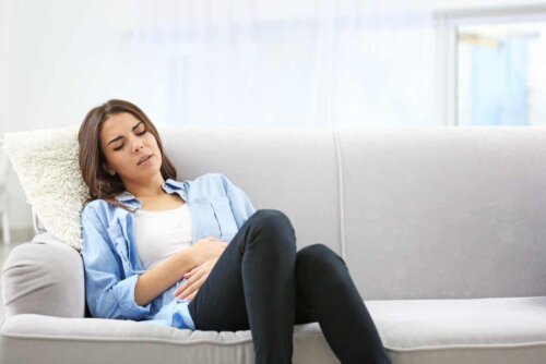 A woman experiencing cramps.