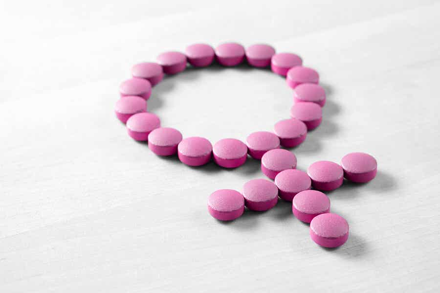 Purple pills forming the female sign.