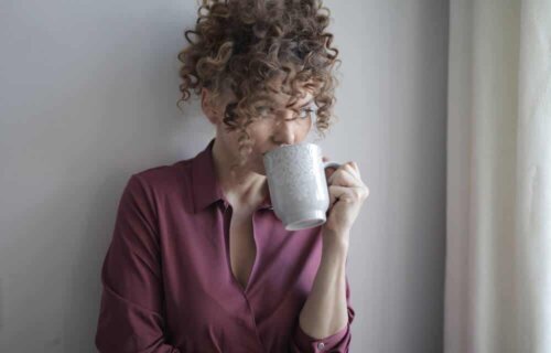 A woman drinking.