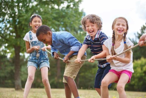 Four children pulling a rope.