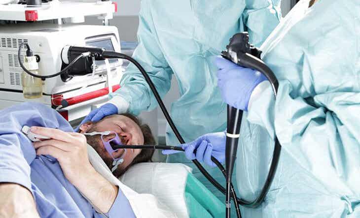 A doctor performing an endoscopy on a patient.