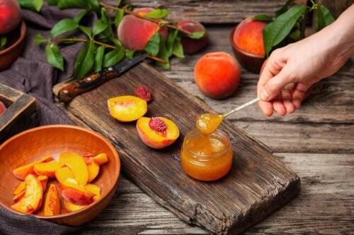 A person making homemade peach jam.