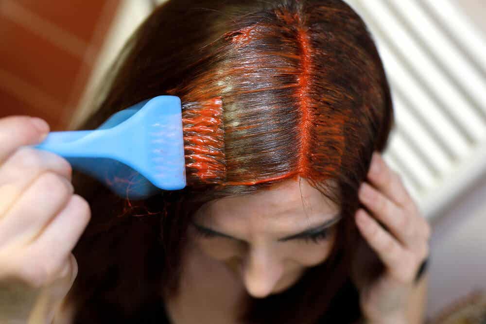 A woman dying her hair