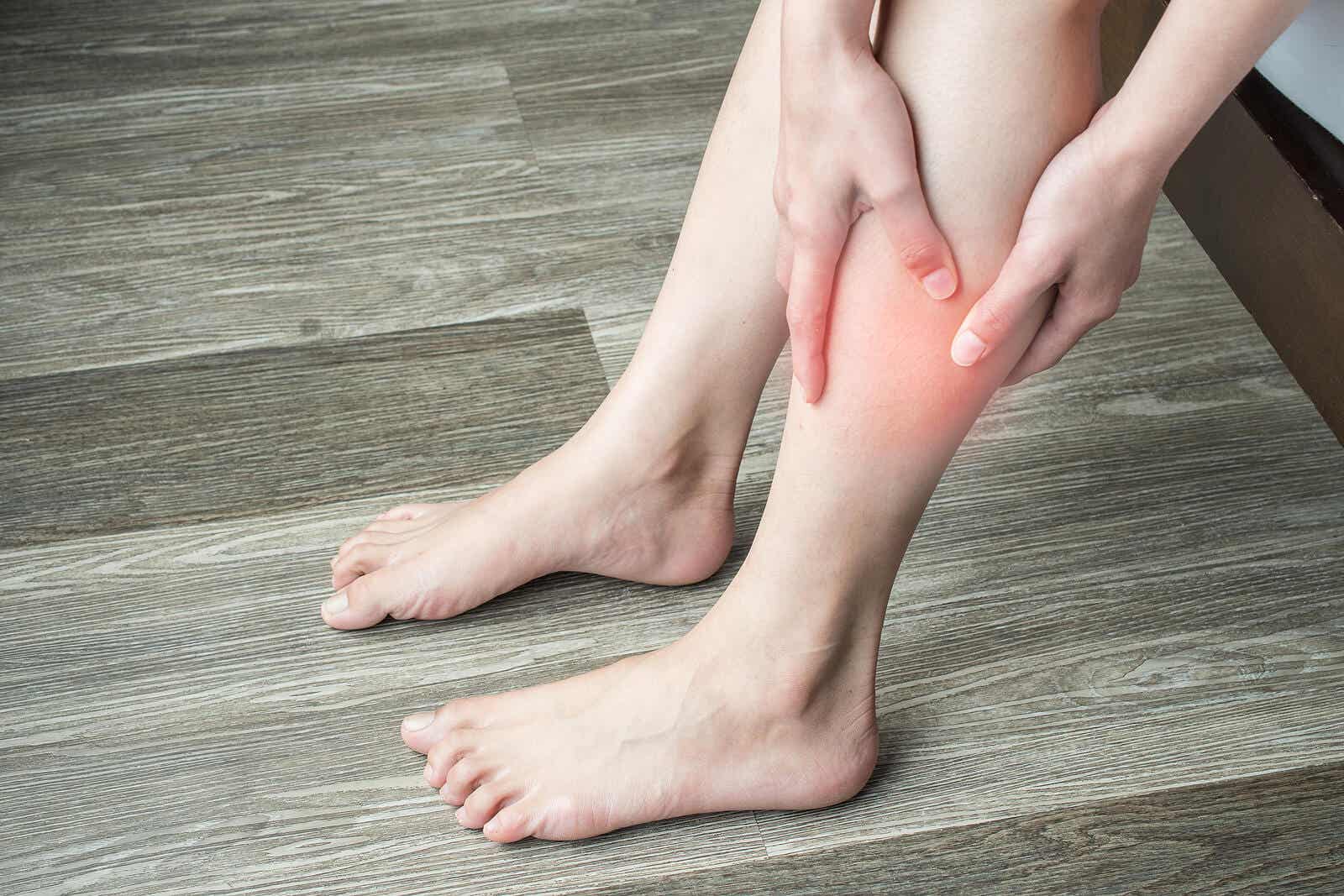 A person rubbing their calf.