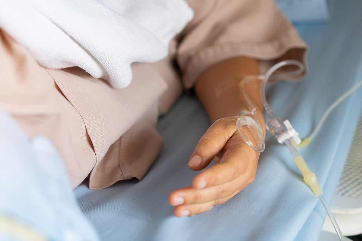 Laetrile or amygdalin to treat cancer: A patient's hand with an IV catheter.